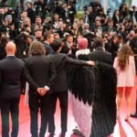 Bird man on red carpet leaves Cannes squawking