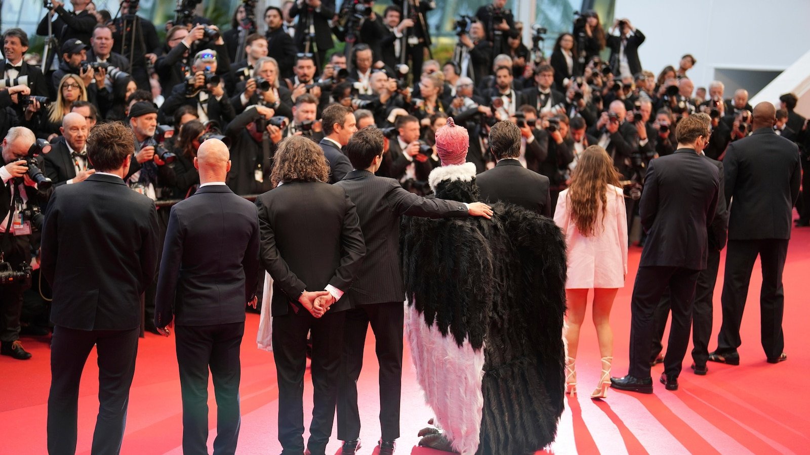 Bird man on red carpet leaves Cannes squawking