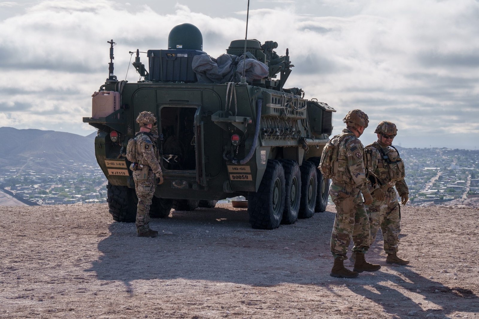 Photo: US Army soldiers are outside a Stryker armored infantry