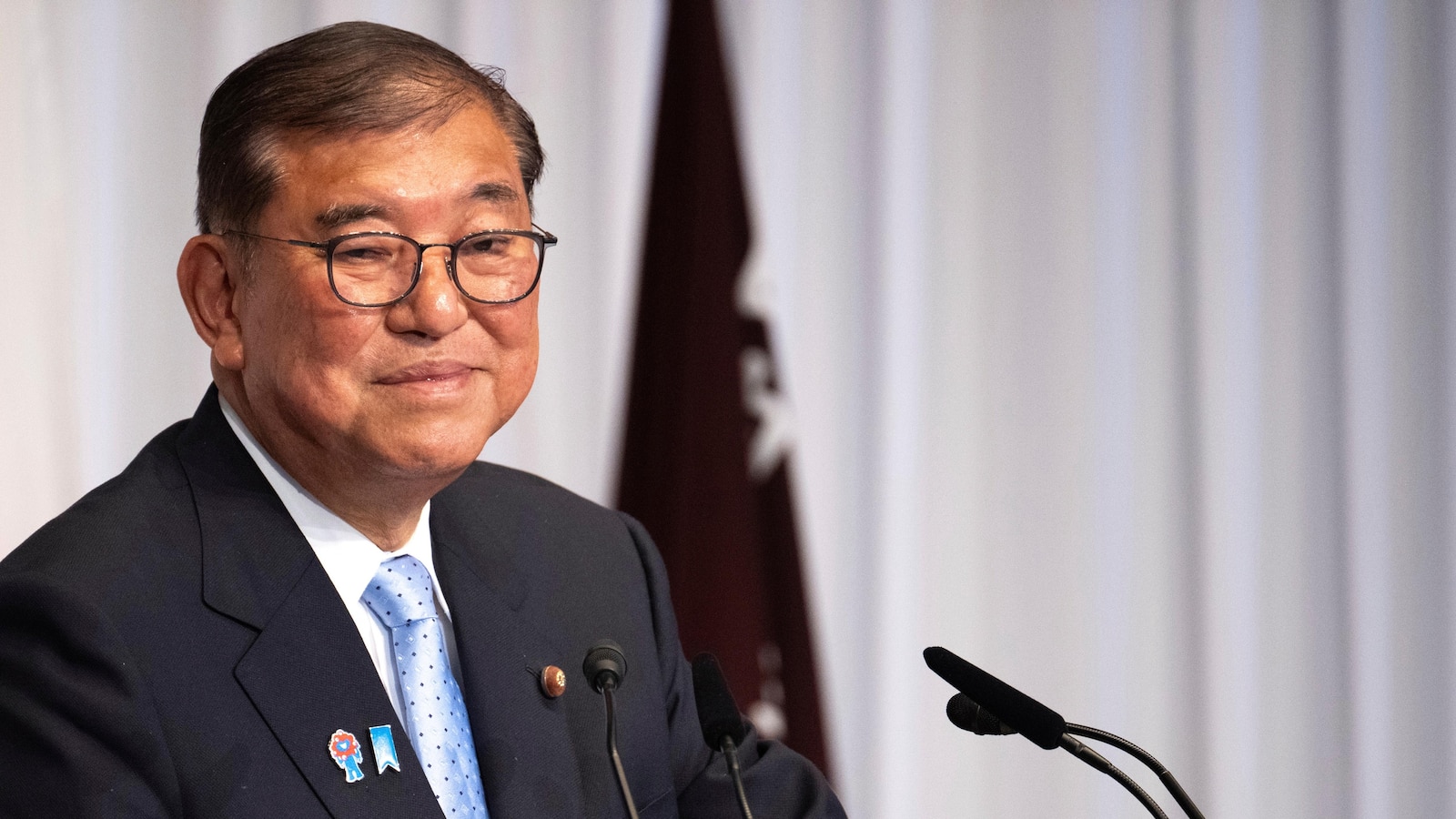 Japanese PM stays on to tackle high inflation, US tariffs despite a key election loss