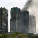 Hong Kong fire death toll rises to 128, officials say